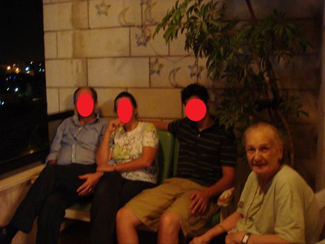 A group of people sitting on a bench

Description automatically generated